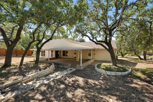 a large tree in front of a house