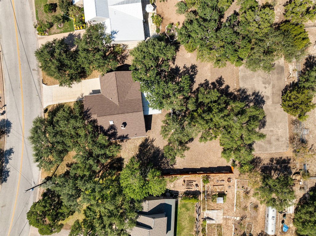 9424 El Rey Boulevard Austin, TX 78737 - Photo 30 of 35 an aerial view of a house with yard and outdoor seating