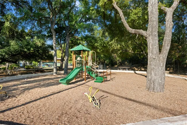 a view of a park with swings