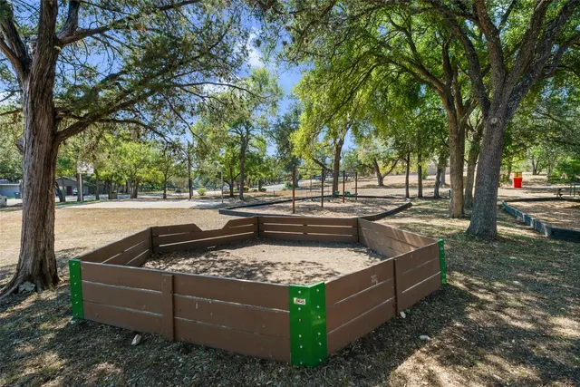 a view of a bench in a backyard