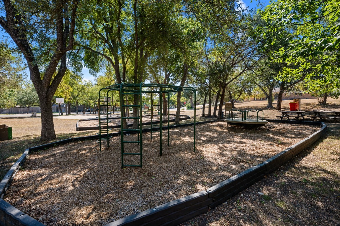 9424 El Rey Boulevard Austin, TX 78737 - Photo 35 of 35 a view of a bench in a backyard