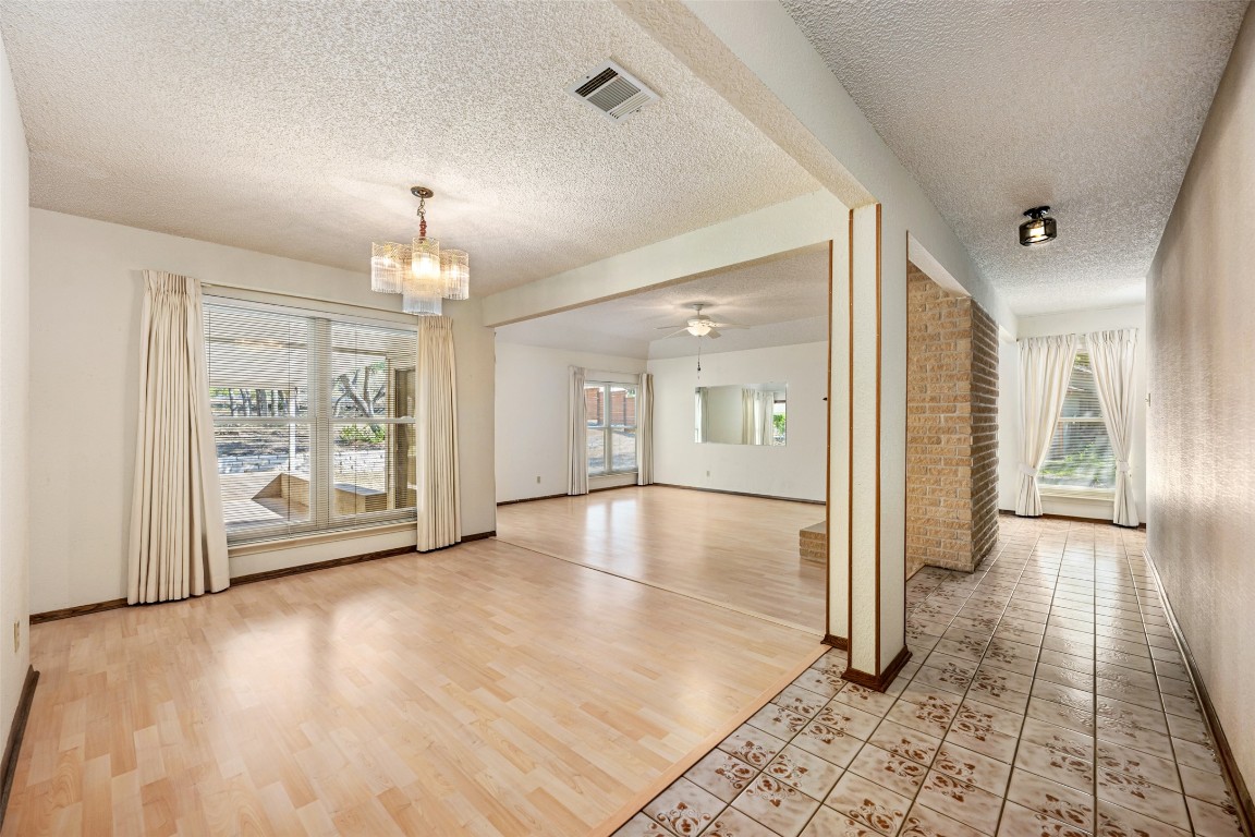 9424 El Rey Boulevard Austin, TX 78737 - Photo 9 of 35 a view of a big room with large windows