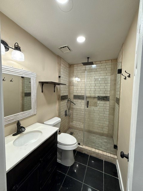 23311 Whittaker Way Spring, TX 77373 - Photo 8 of 12 a bathroom with a sink a toilet a mirror and shower