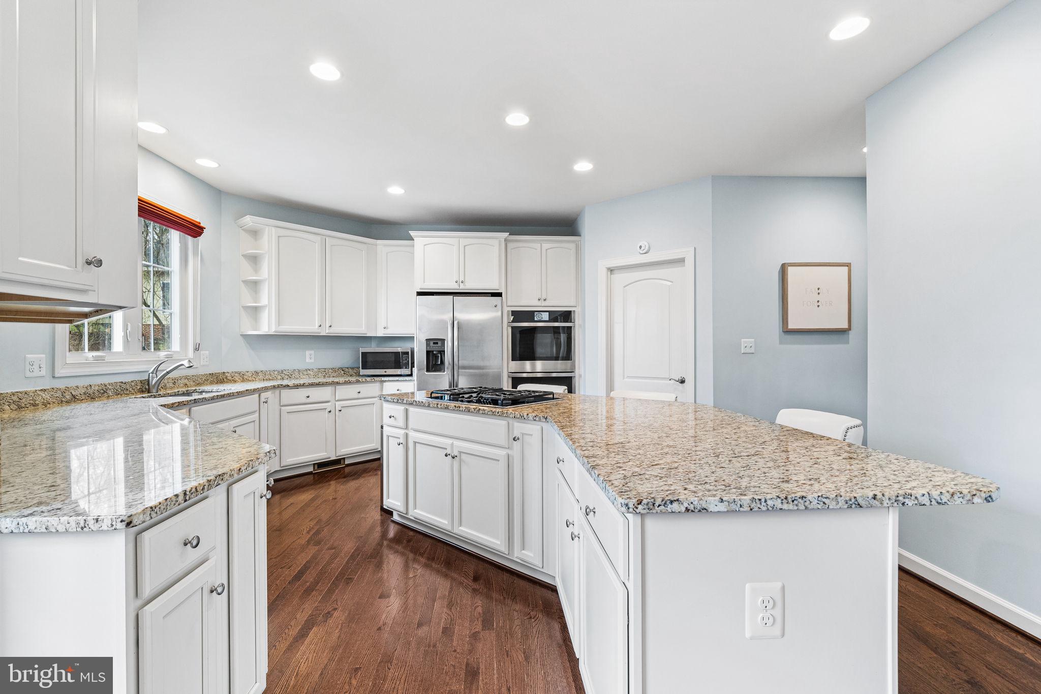 1232 Shenandoah Road Alexandria, VA 22308 - Photo 23 of 50 a kitchen with granite countertop sink stove and refrigerator