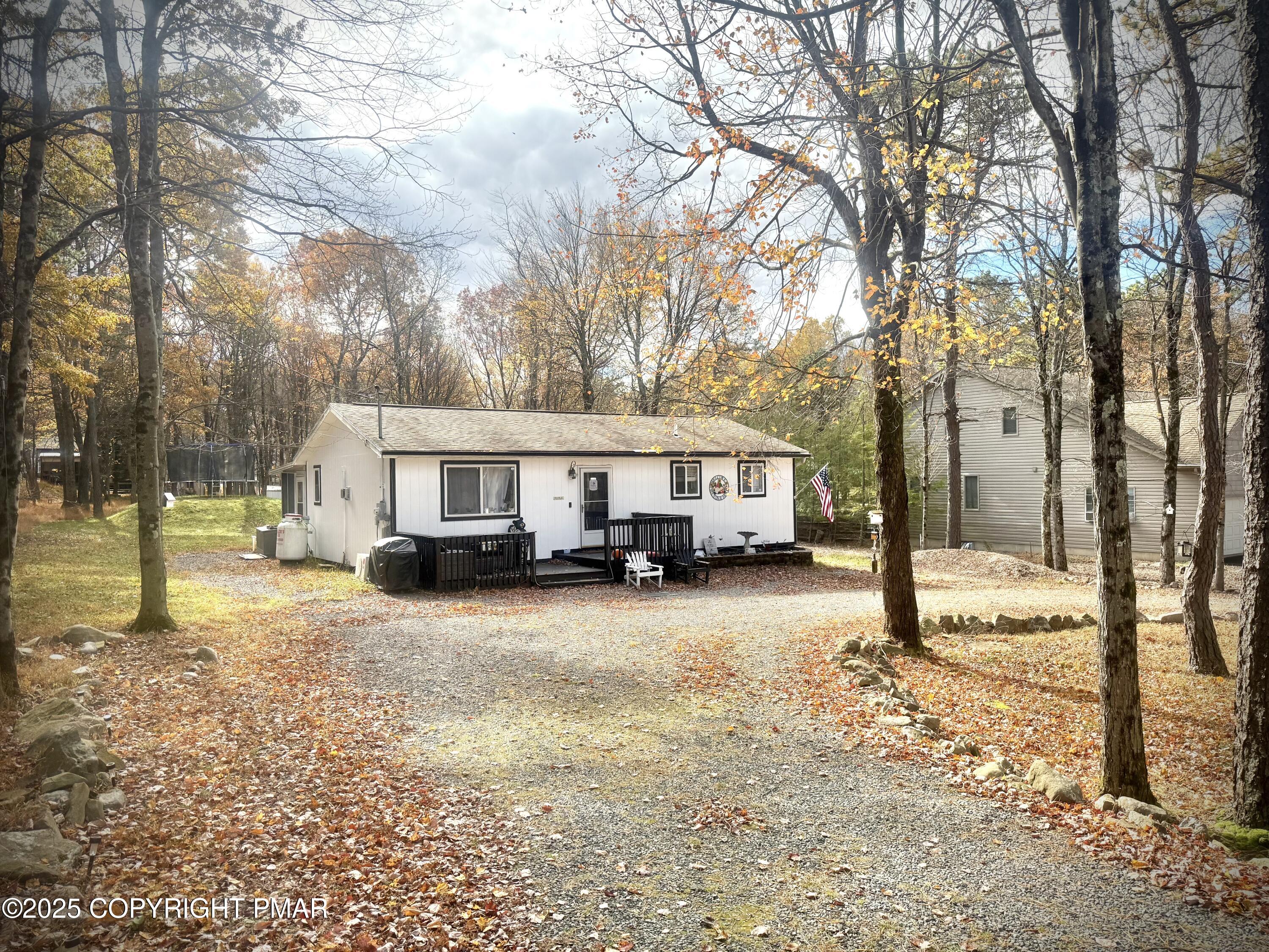 114 Maccauley Road Albrightsville, PA 18210 - Photo 1 of 21 a view of a house with a yard covered in snow