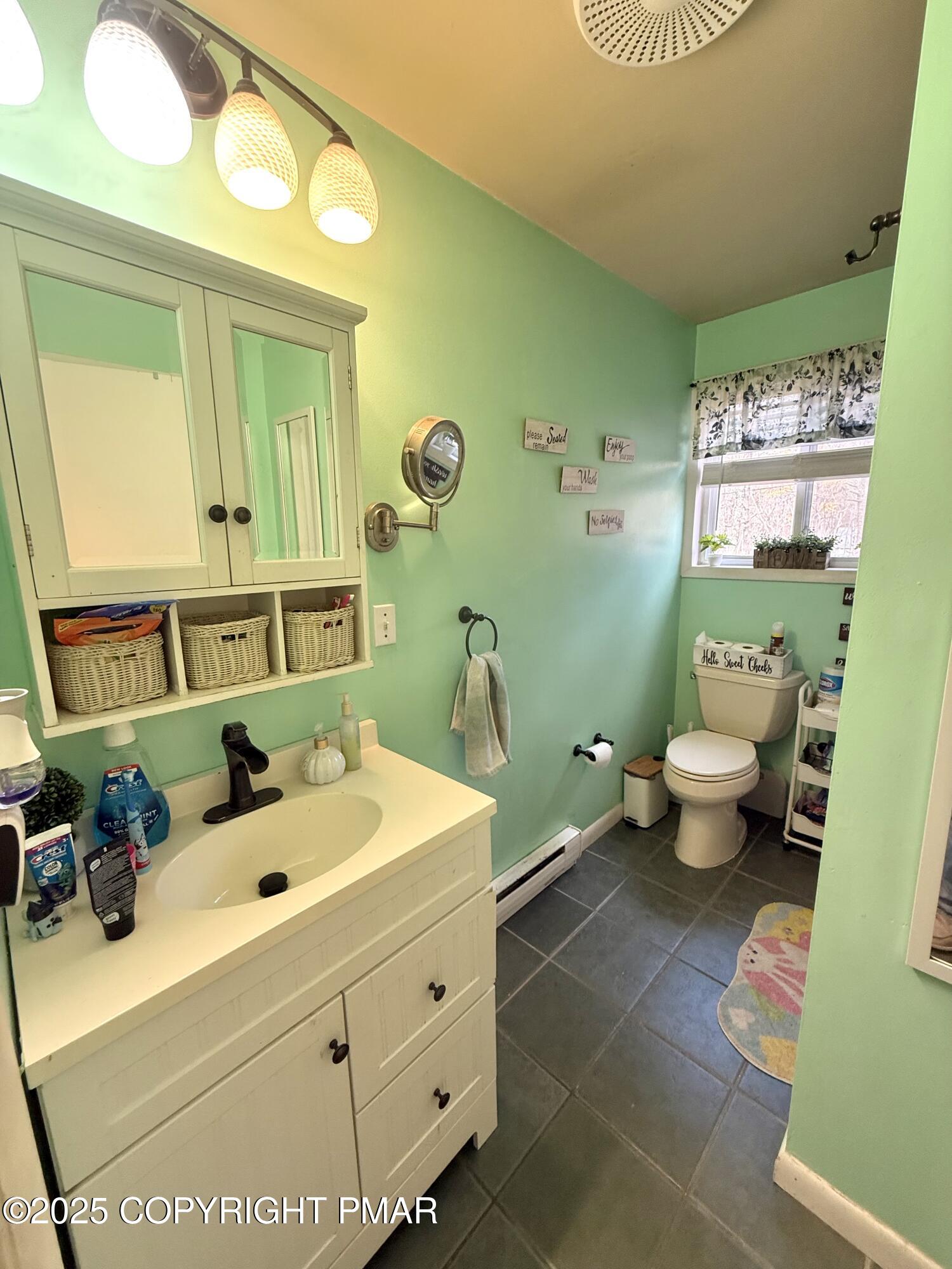 114 Maccauley Road Albrightsville, PA 18210 - Photo 11 of 21 a bathroom with a sink mirror and toilet