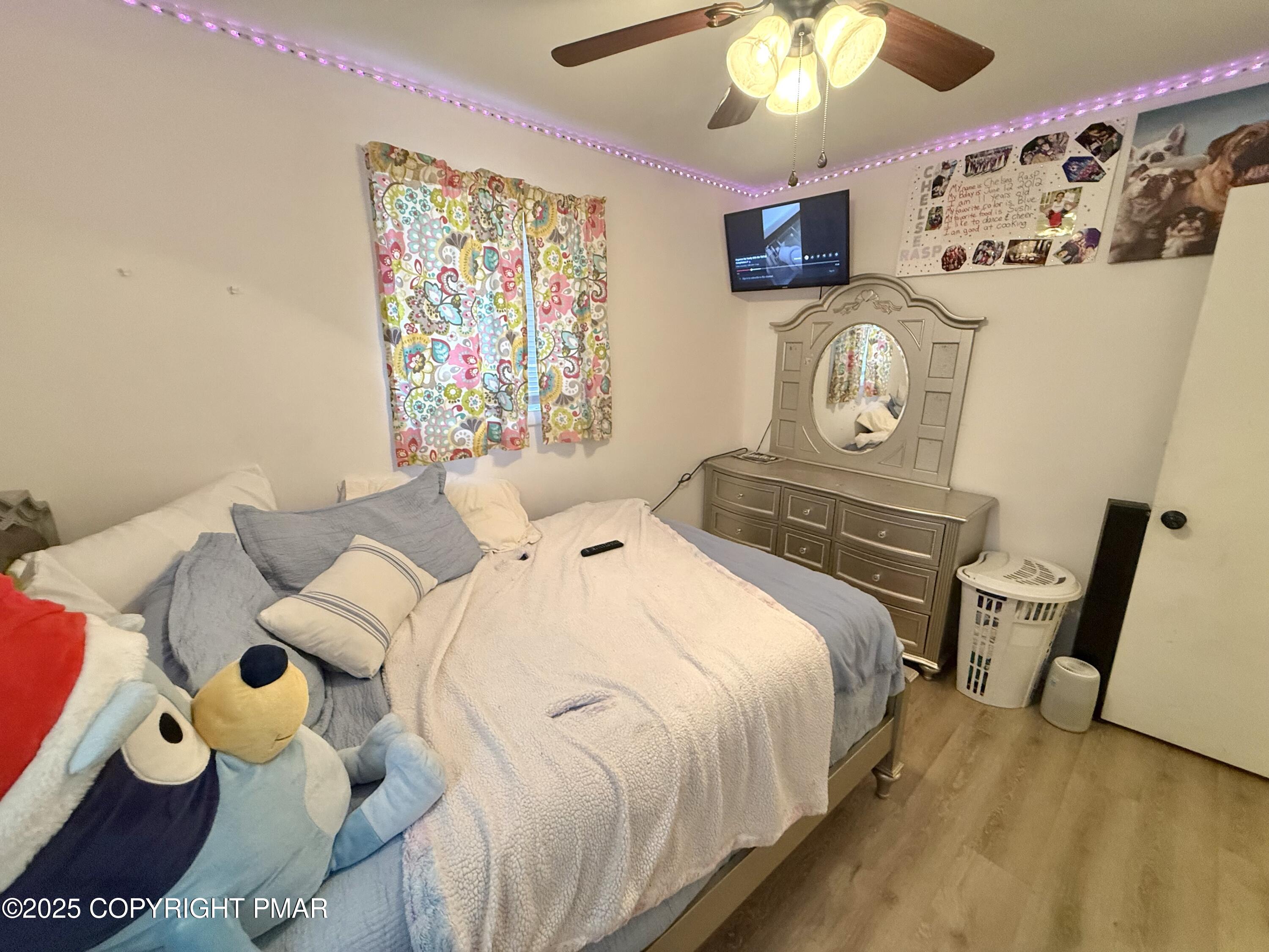 114 Maccauley Road Albrightsville, PA 18210 - Photo 14 of 21 a bedroom with a bed and a table in it