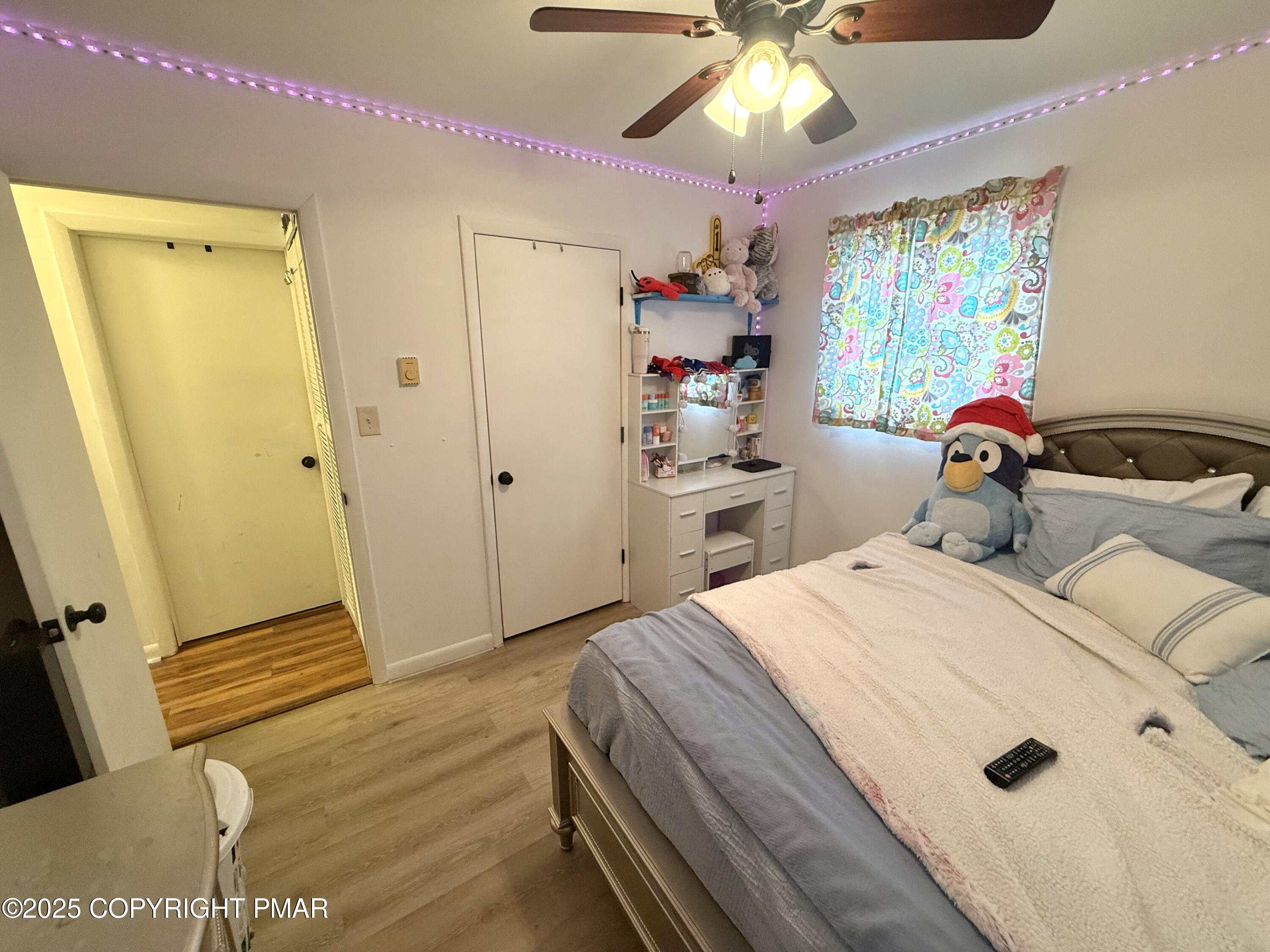 114 Maccauley Road Albrightsville, PA 18210 - Photo 15 of 21 a bedroom with a bed and a chandelier