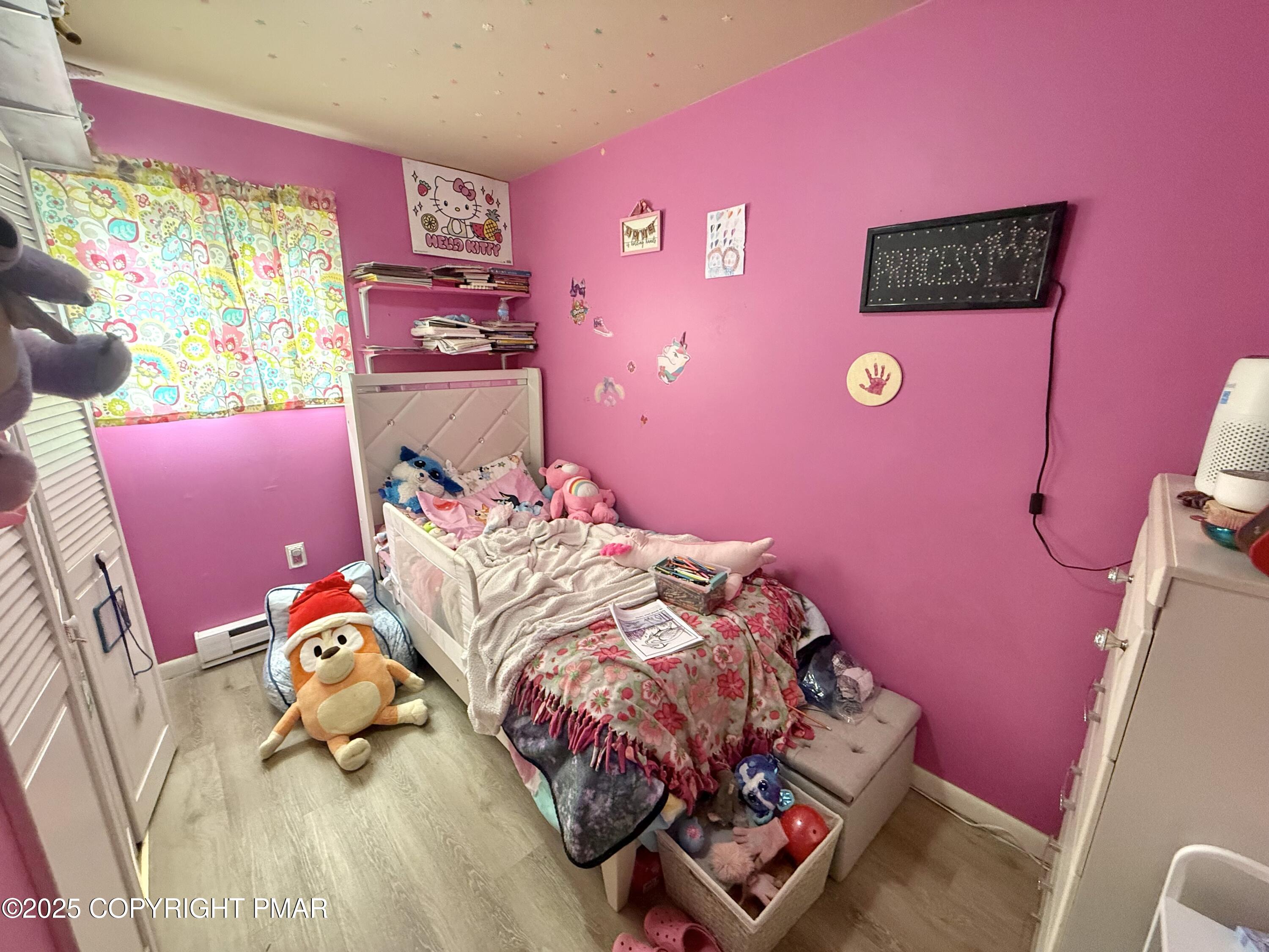 114 Maccauley Road Albrightsville, PA 18210 - Photo 17 of 21 a bedroom with a bed and a chair