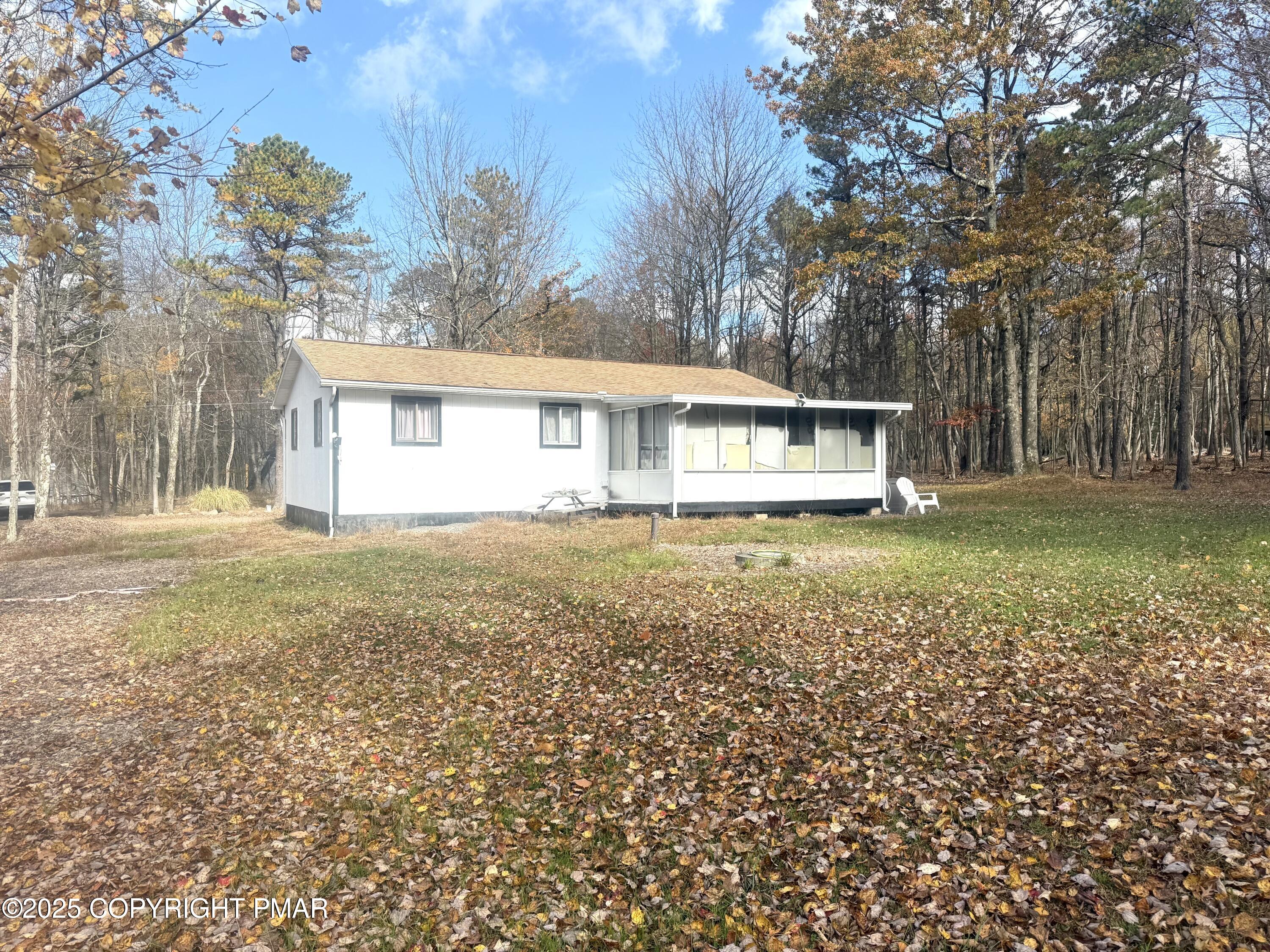114 Maccauley Road Albrightsville, PA 18210 - Photo 20 of 21 a view of house with yard and outdoor seating