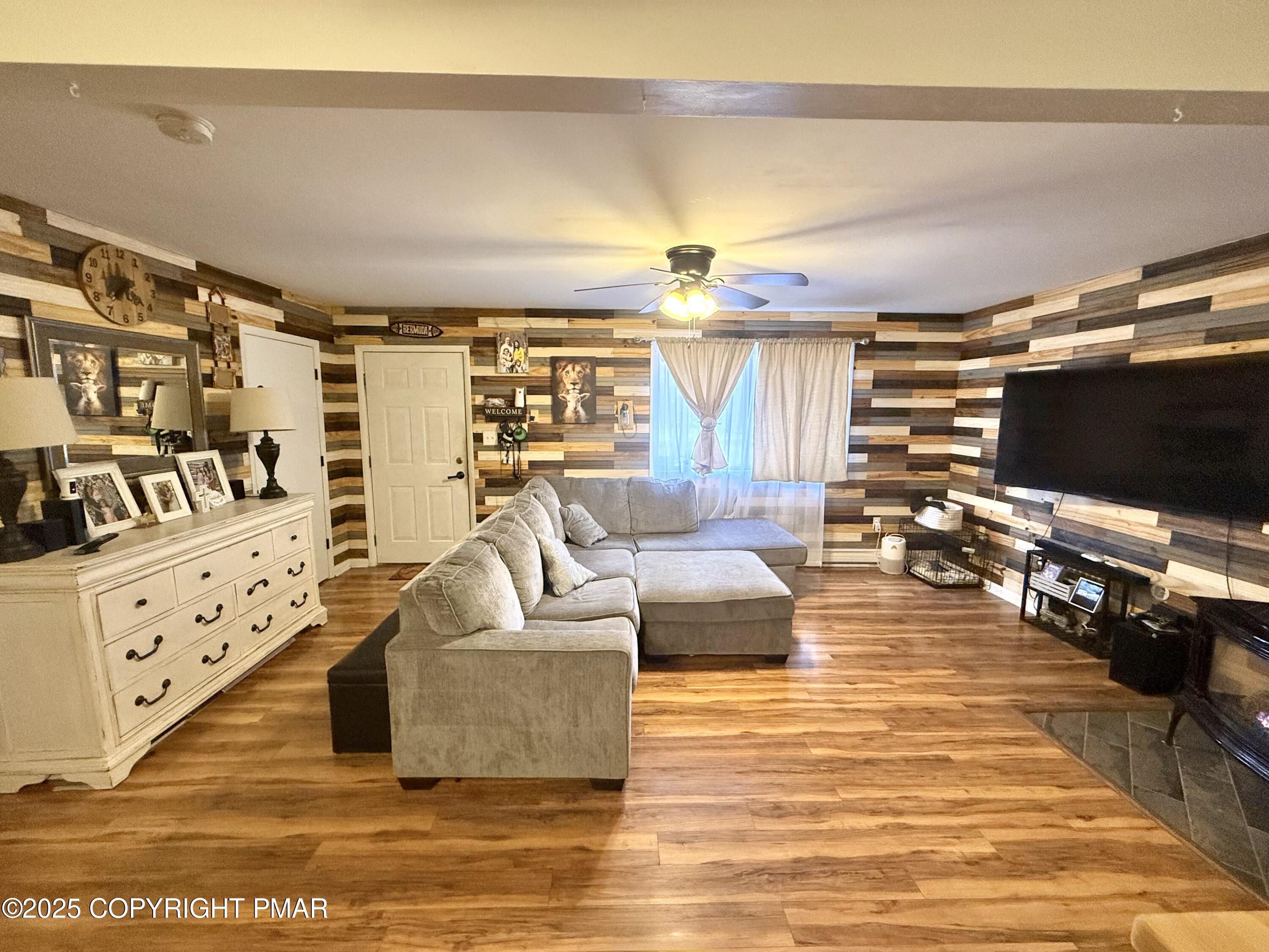 114 Maccauley Road Albrightsville, PA 18210 - Photo 2 of 21 a living room with furniture and a flat screen tv