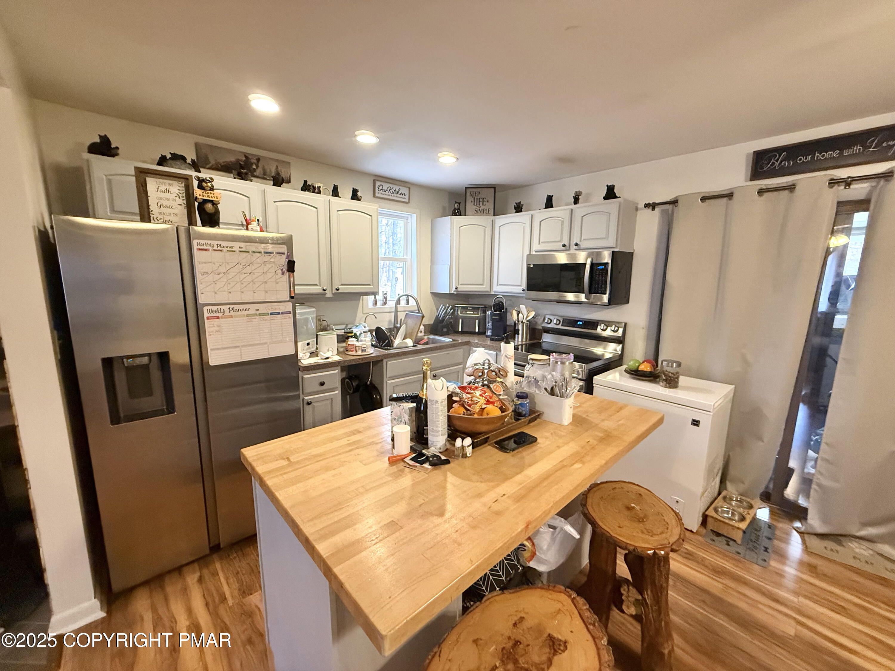 114 Maccauley Road Albrightsville, PA 18210 - Photo 3 of 21 a kitchen with kitchen island a refrigerator sink stove and microwave