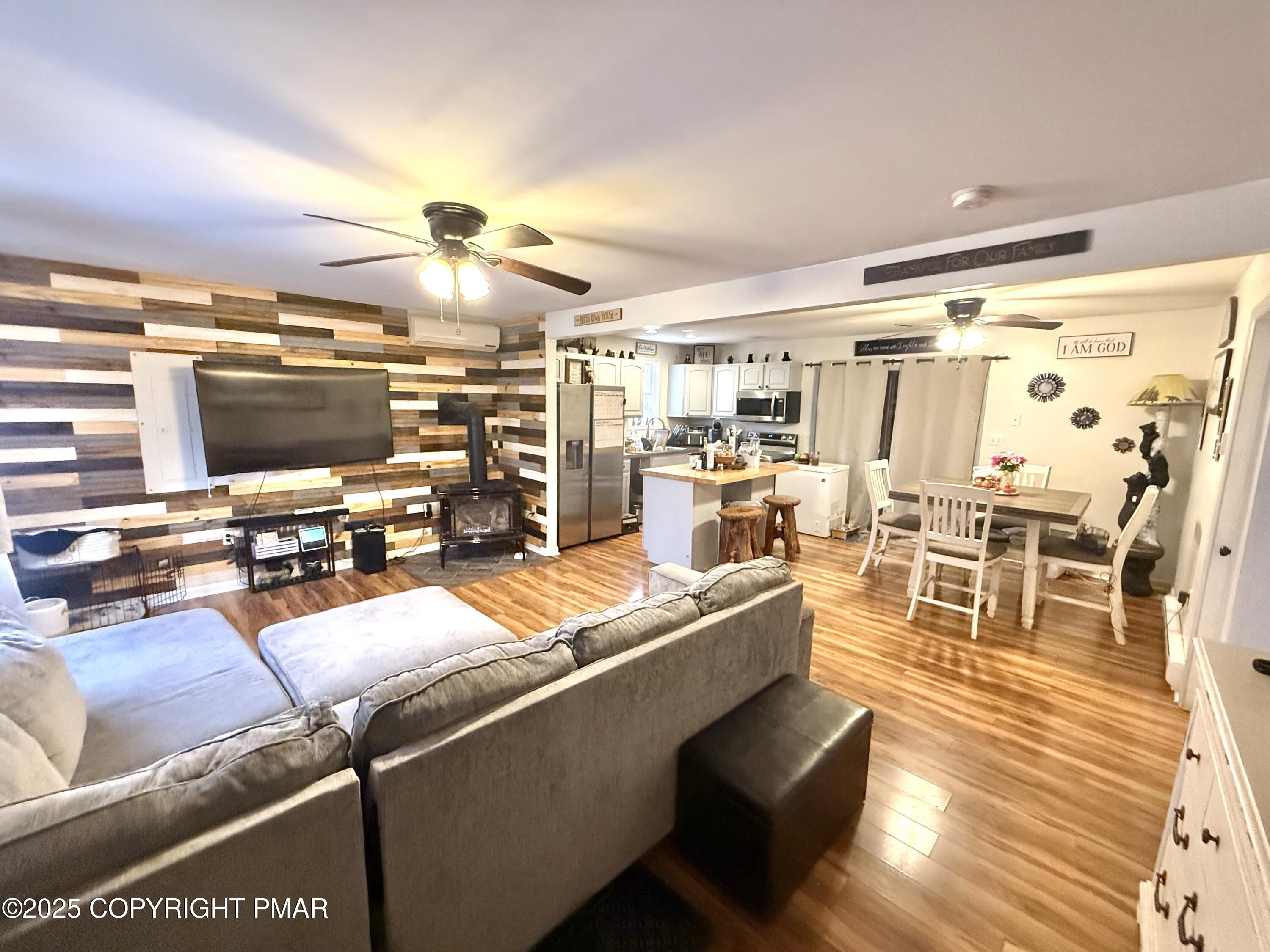 114 Maccauley Road Albrightsville, PA 18210 - Photo 5 of 21 a living room with lots of dining room and wooden floor