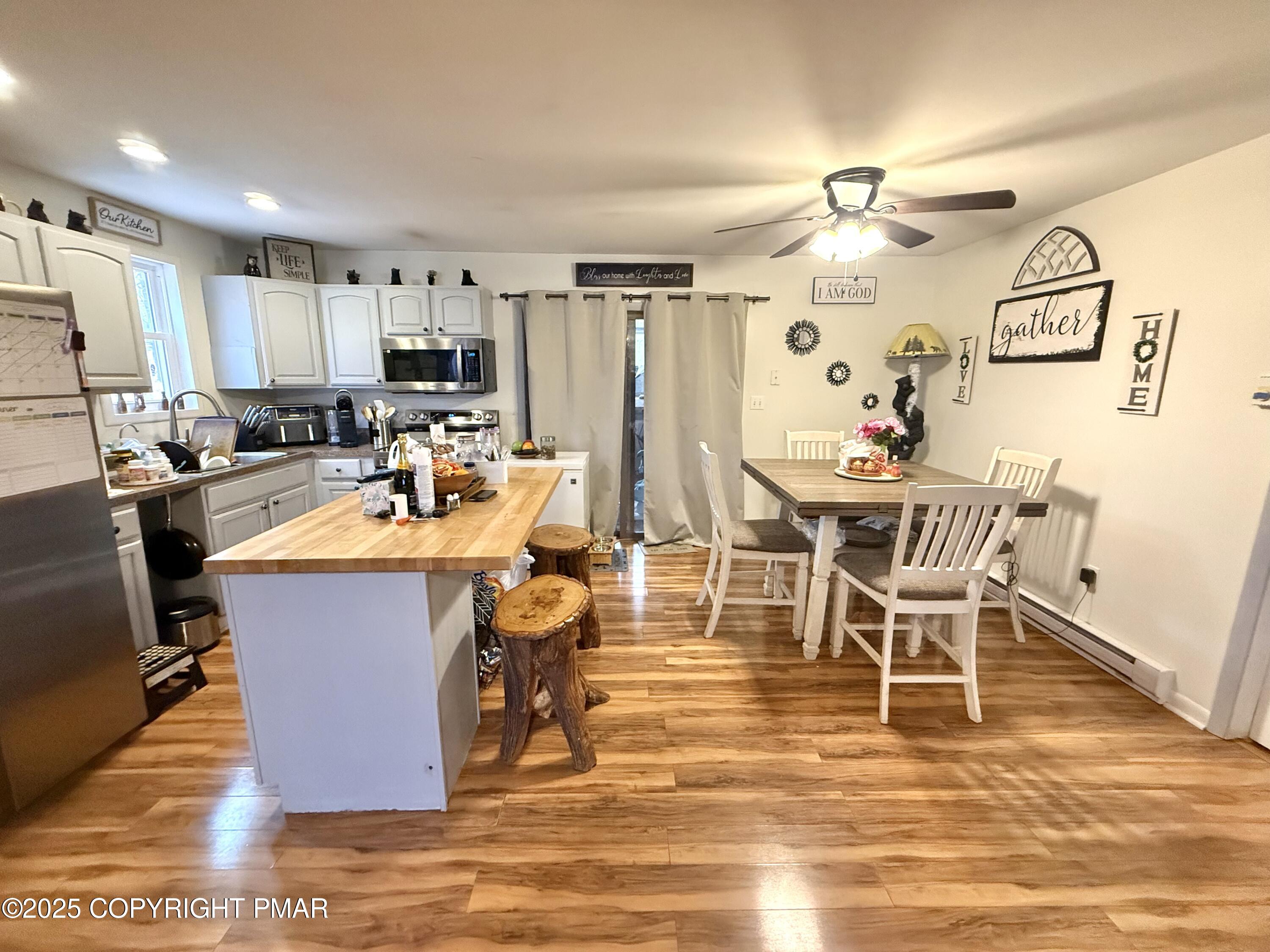 114 Maccauley Road Albrightsville, PA 18210 - Photo 9 of 21 a view of a dining room with furniture and a kitchen view