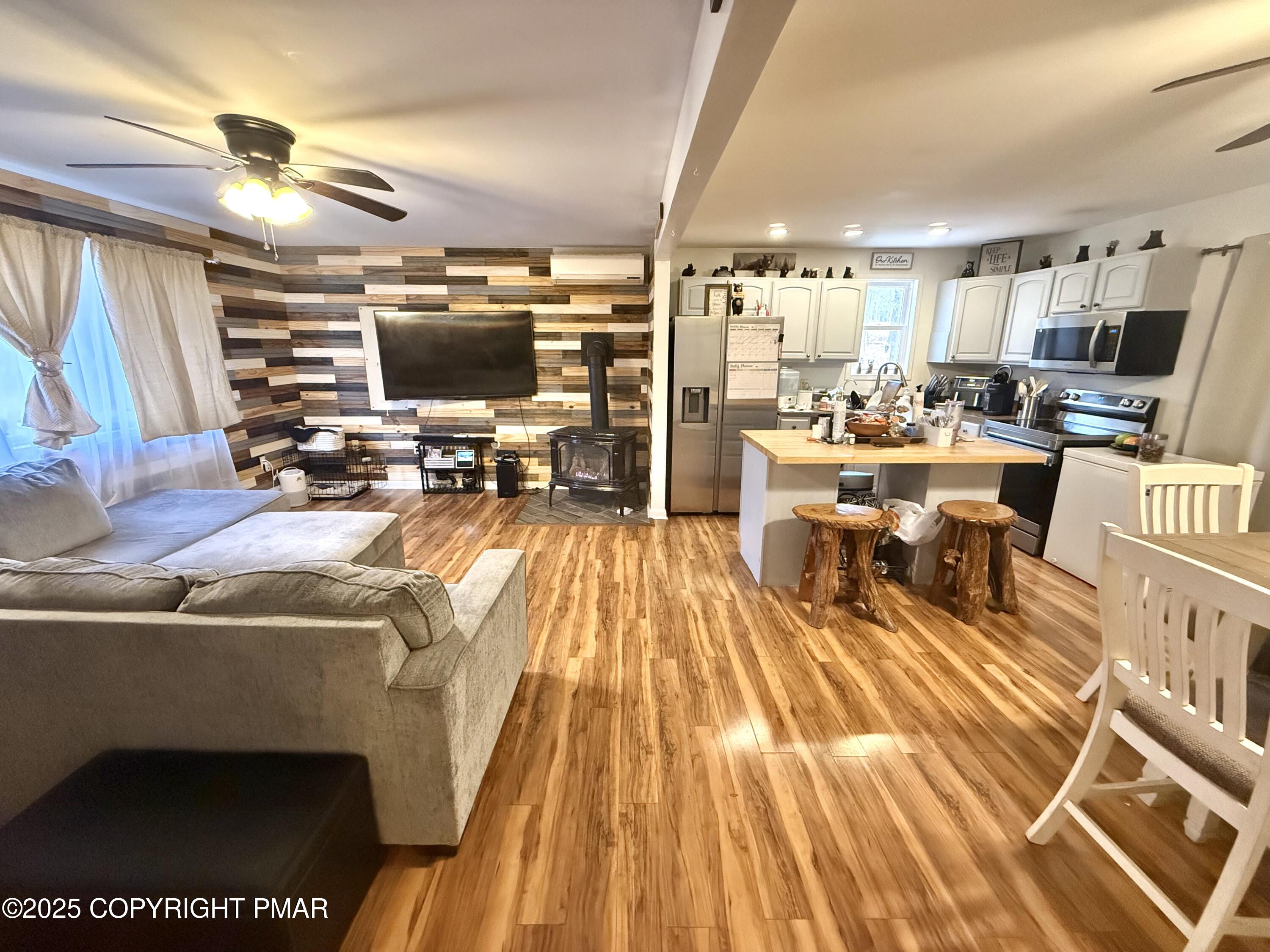 114 Maccauley Road Albrightsville, PA 18210 - Photo 10 of 21 a living room with lots of furniture and a wooden floor