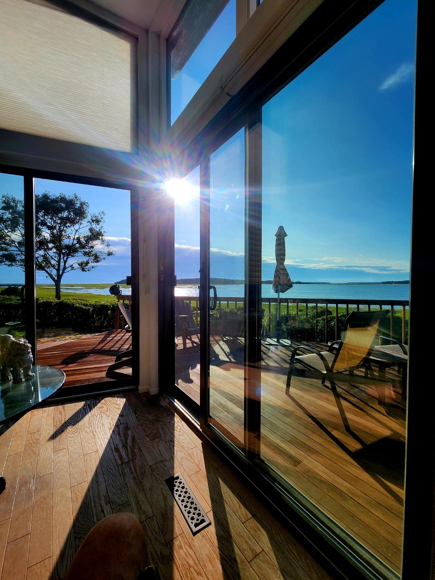 20 Catboat Road Wellfleet, MA 02667 - Photo 13 of 53 a view of a balcony with chairs