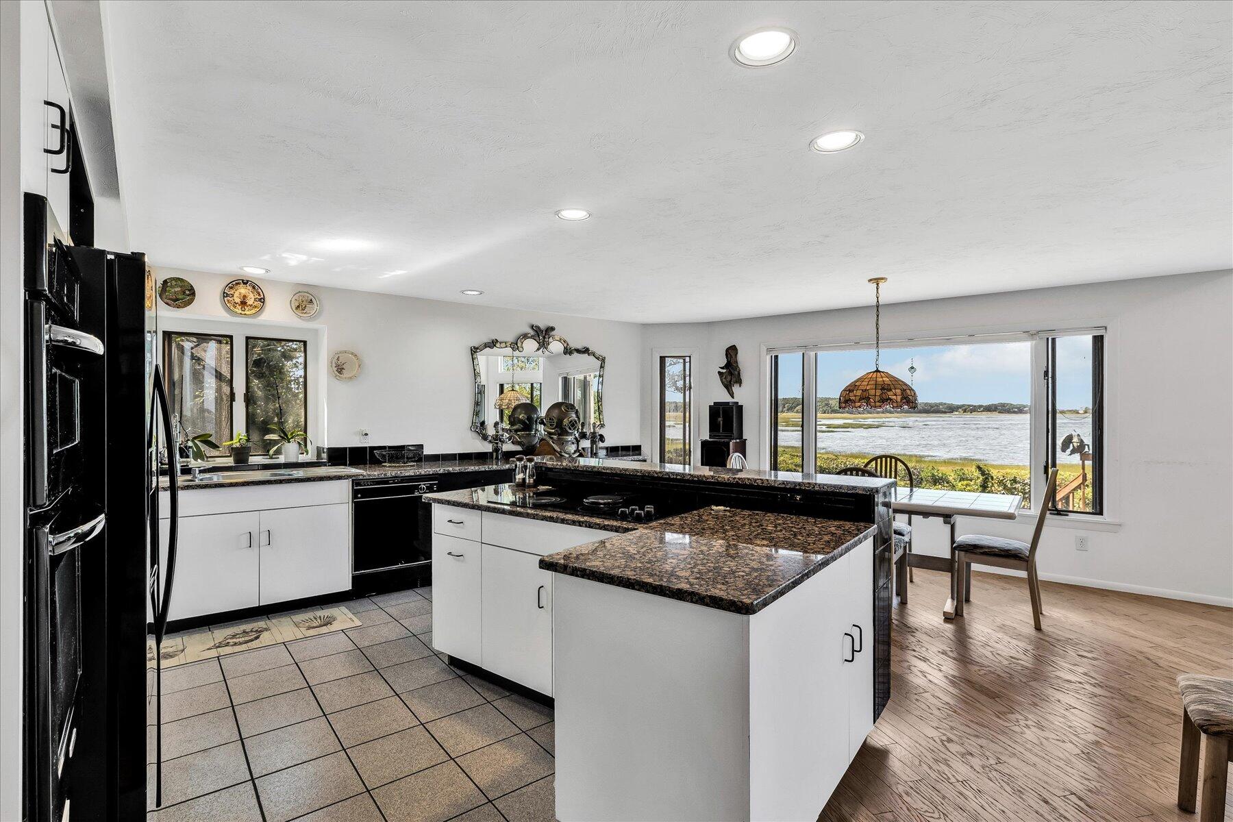 20 Catboat Road Wellfleet, MA 02667 - Photo 26 of 53 a kitchen with stainless steel appliances granite countertop a sink and a refrigerator