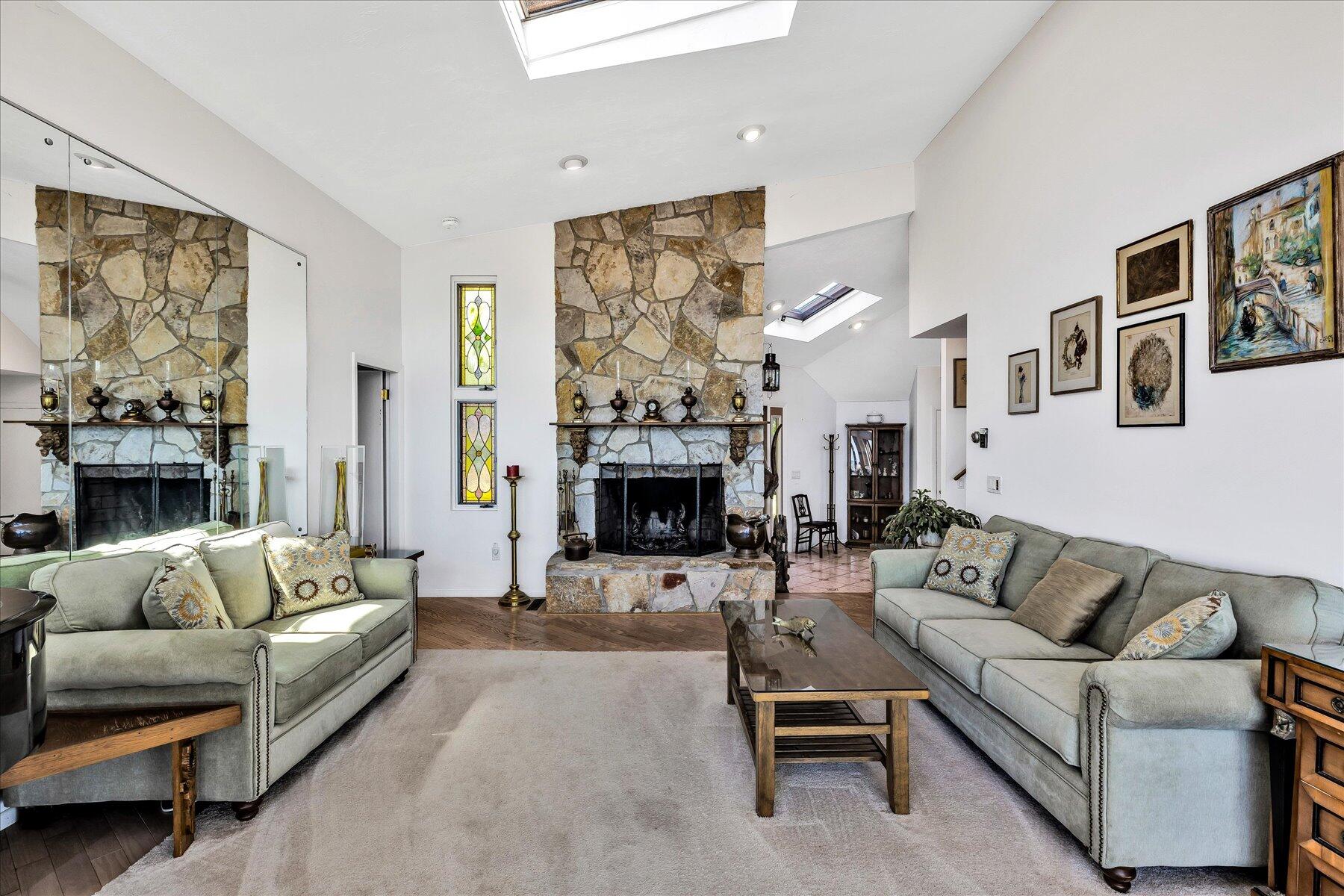 20 Catboat Road Wellfleet, MA 02667 - Photo 32 of 53 a living room with furniture a large window and a fireplace