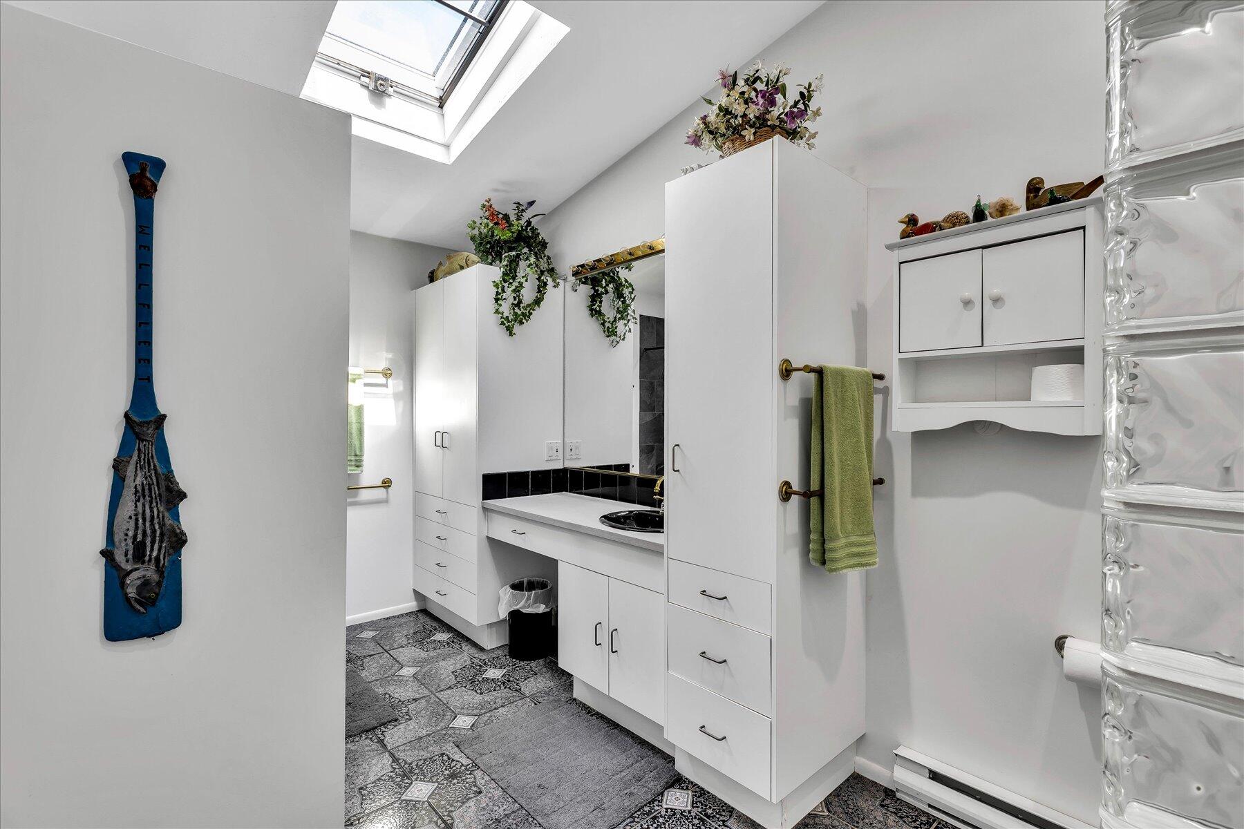 20 Catboat Road Wellfleet, MA 02667 - Photo 41 of 53 a kitchen with stainless steel appliances a stove and a chandelier