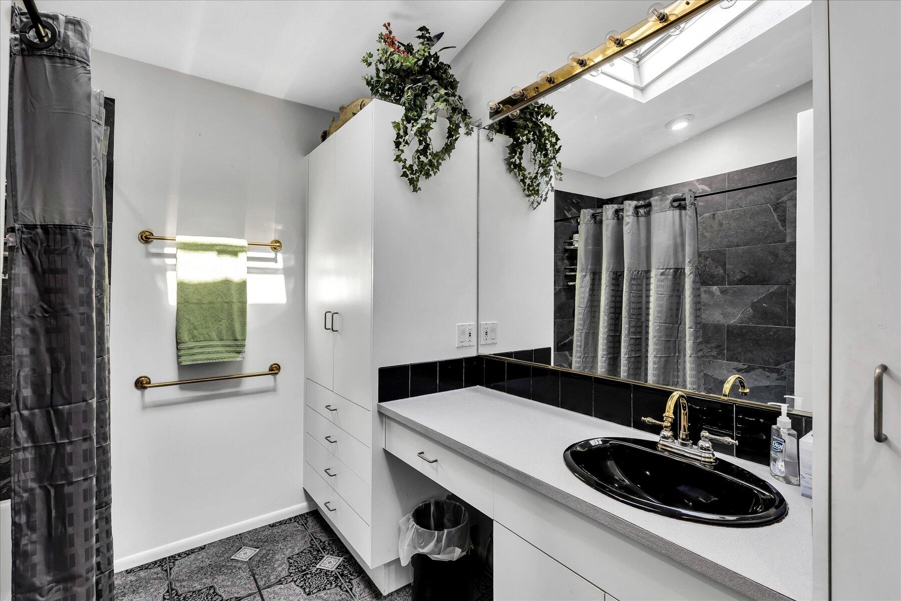 20 Catboat Road Wellfleet, MA 02667 - Photo 42 of 53 a bathroom with a sink and a mirror