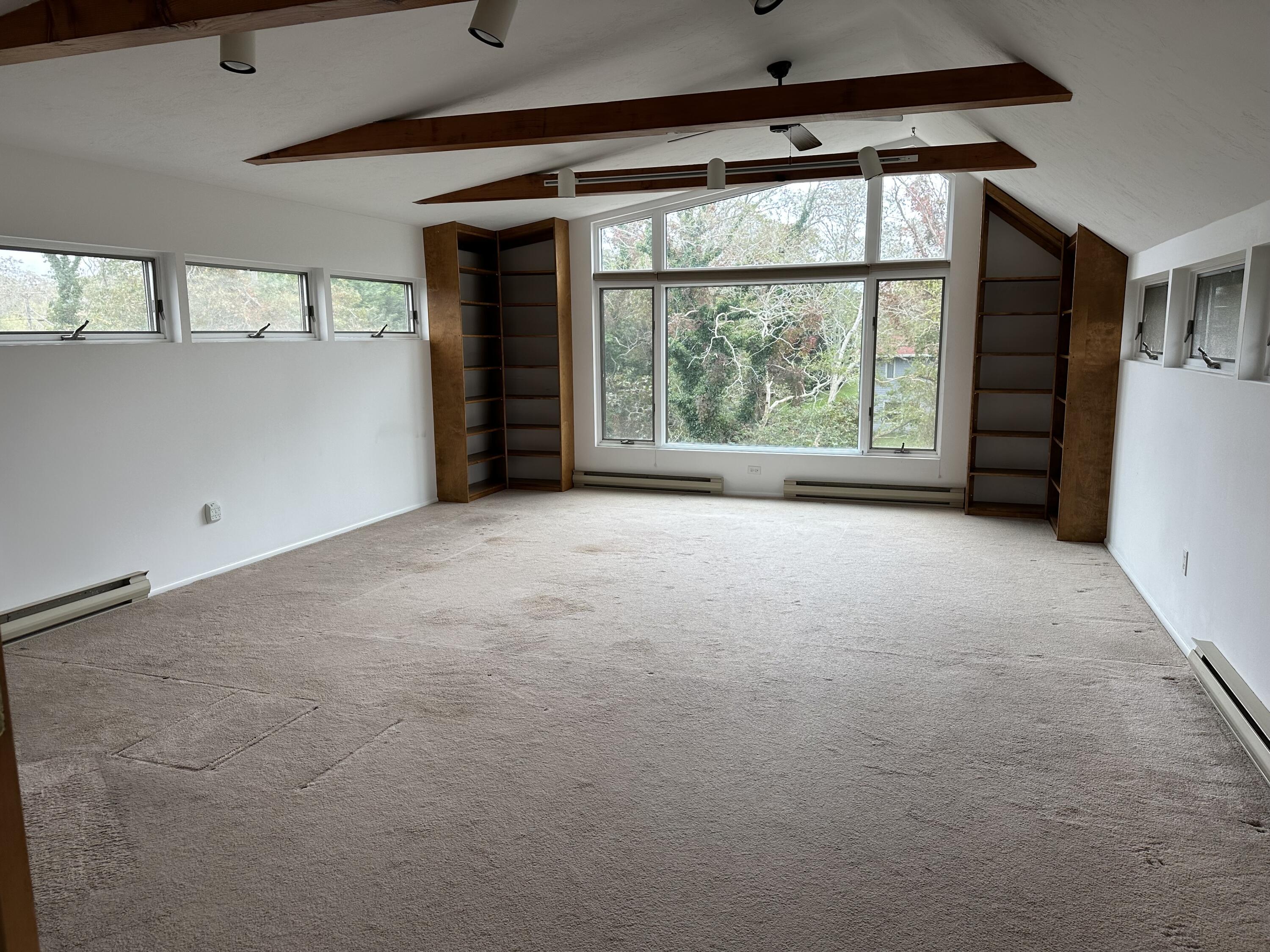 20 Catboat Road Wellfleet, MA 02667 - Photo 46 of 53 en empty room with windows and chandelier