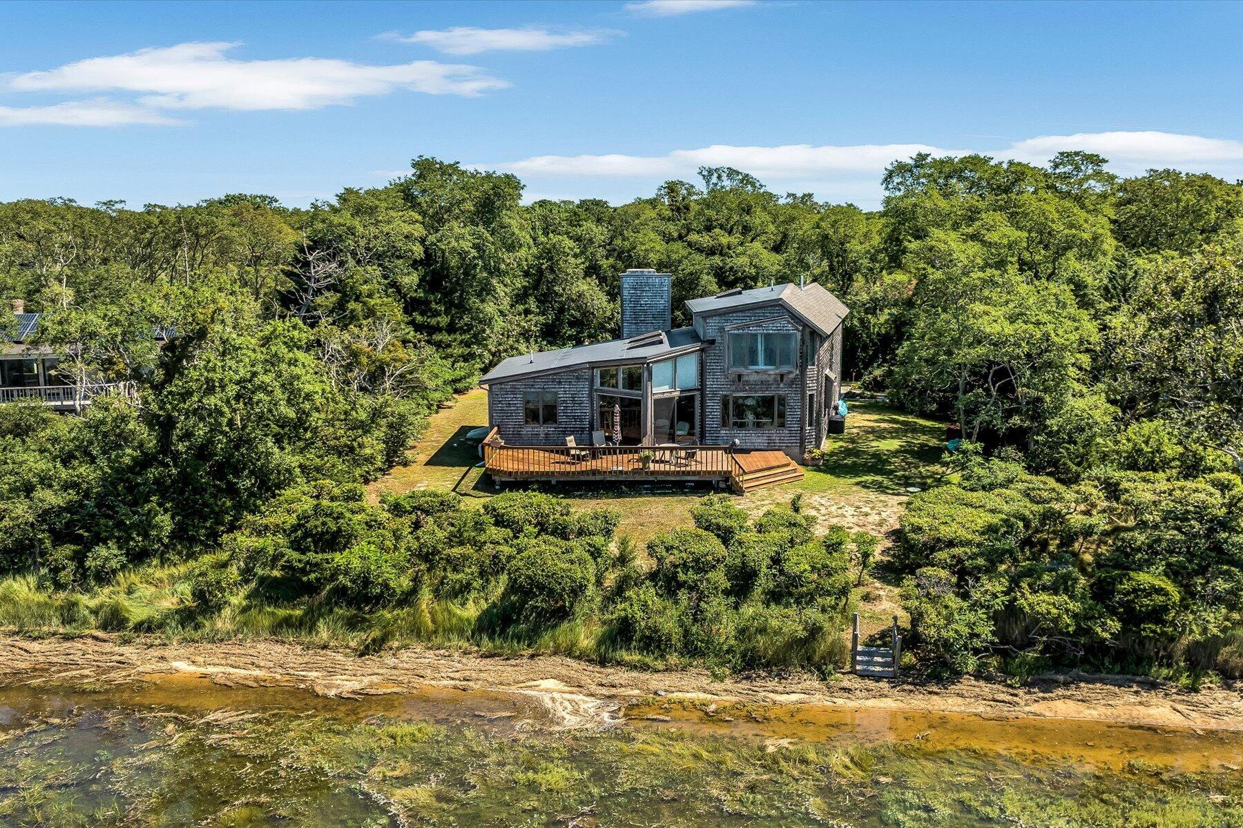 20 Catboat Road Wellfleet, MA 02667 - Photo 48 of 53 a front view of a house with a yard