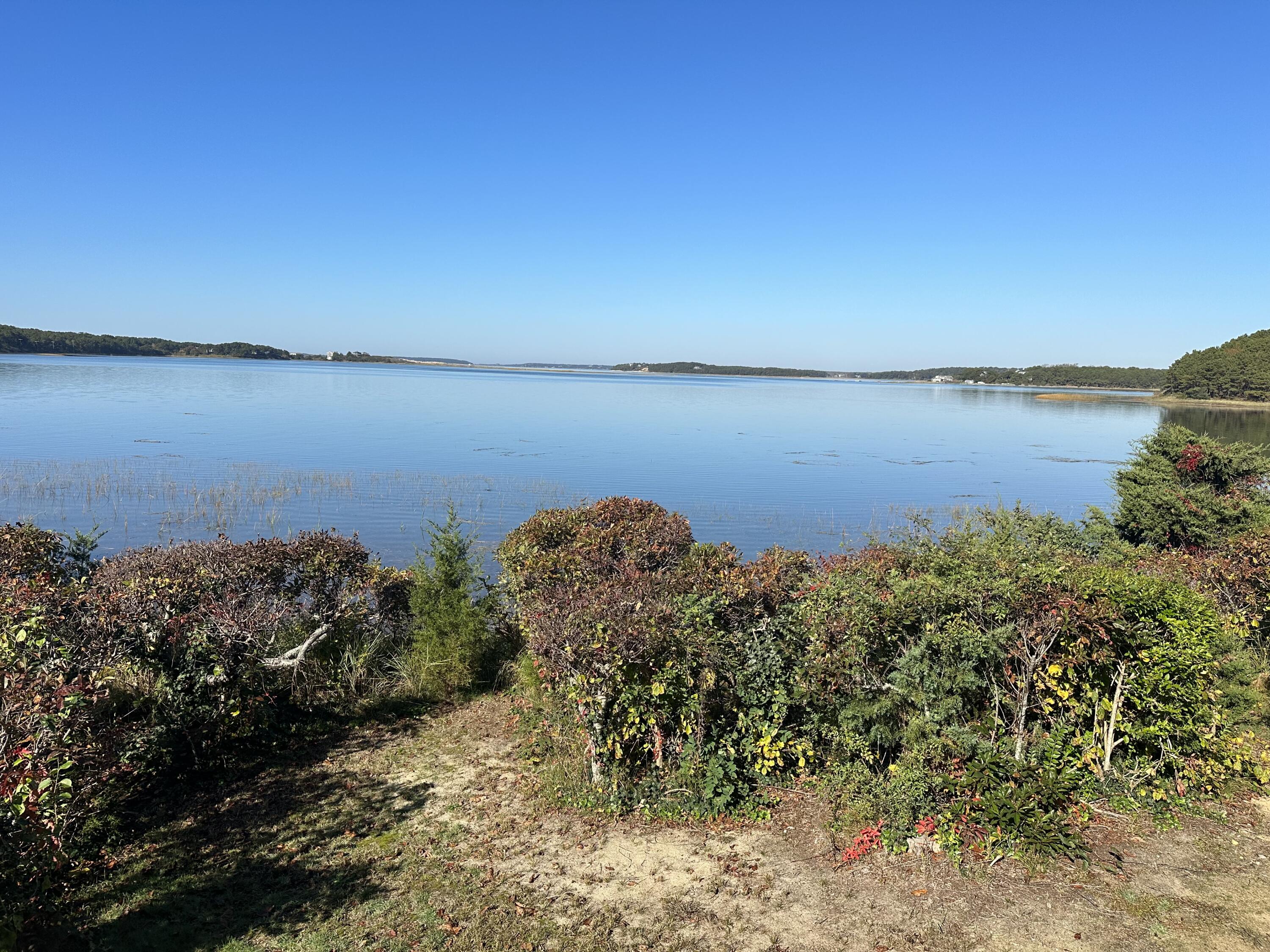 20 Catboat Road Wellfleet, MA 02667 - Photo 51 of 53 a view of a large body of water with a building in the background