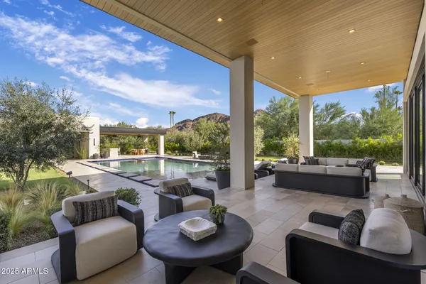 a outdoor living space with patio furniture and garden view