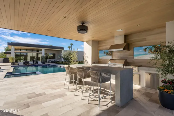 a patio with a table and chairs