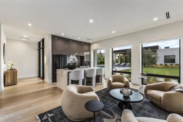 a living room with furniture and a large window