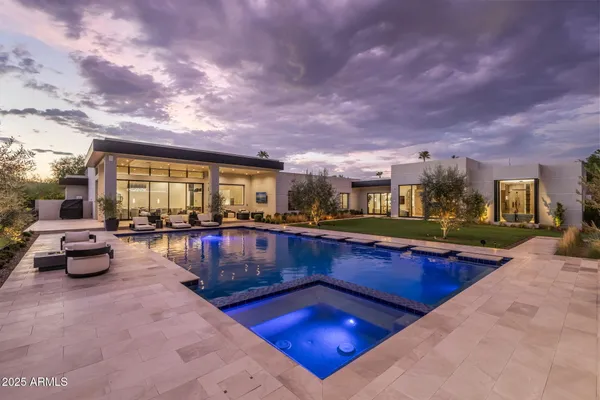 a view of swimming pool with outdoor seating