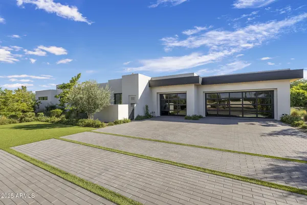 a bed room with a bed and glass door