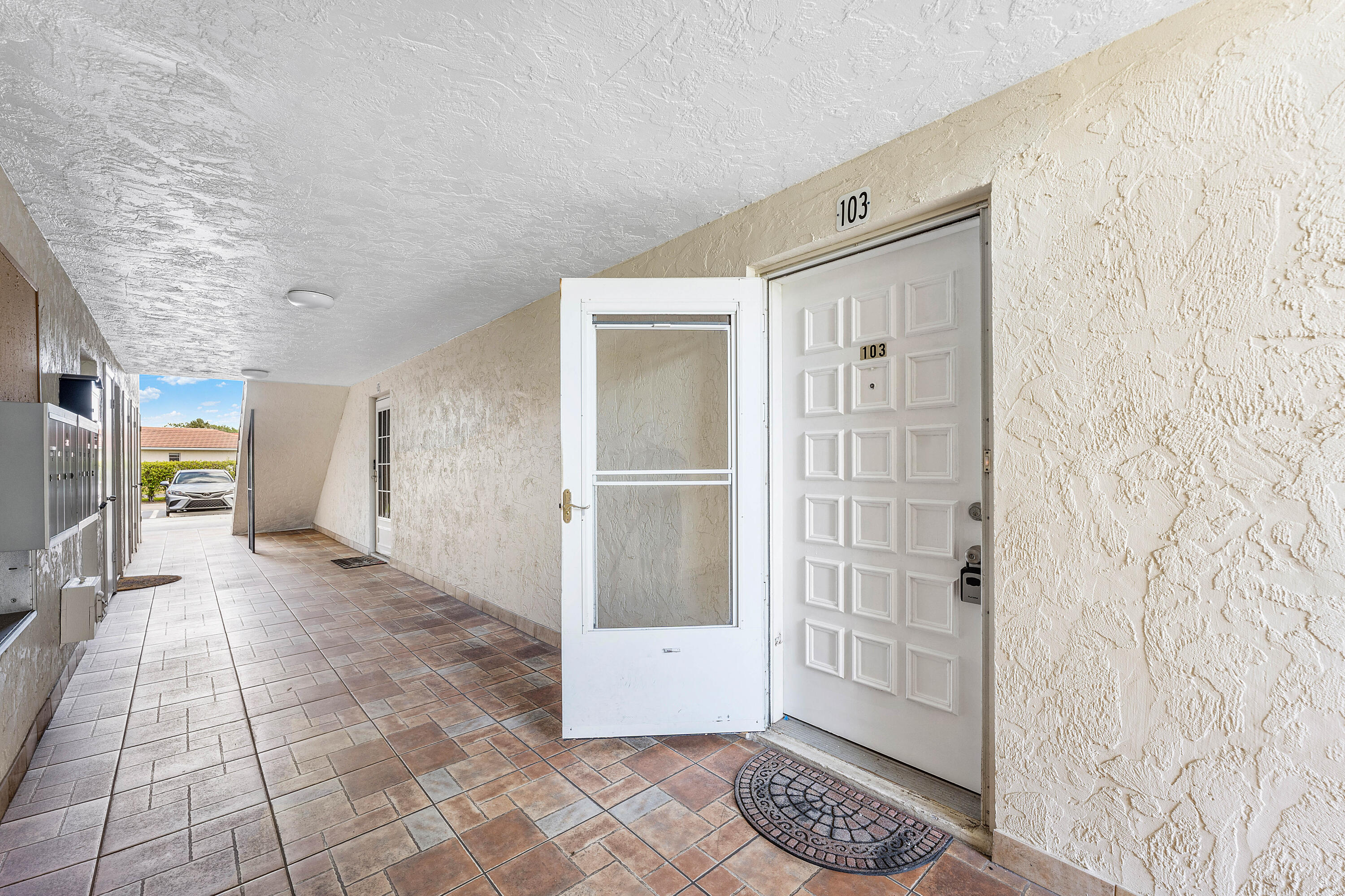 22725 Southwest 66th Avenue, Unit 103 Boca Raton, FL 33428 - Photo 14 of 14 Unit Entrance – First Floor Access