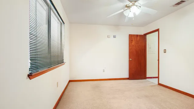 a view of livingroom with floor to ceiling window
