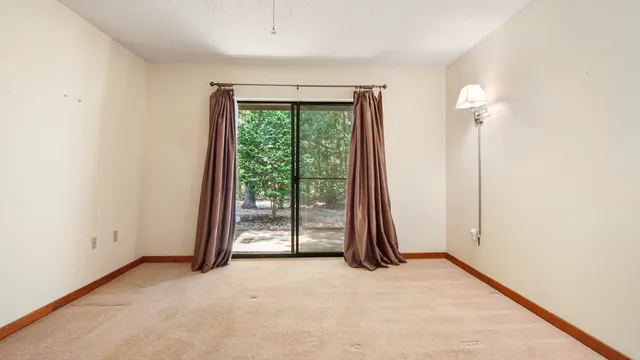 a bathroom with a glass shower door