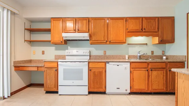 a view of outdoor space with deck and large window