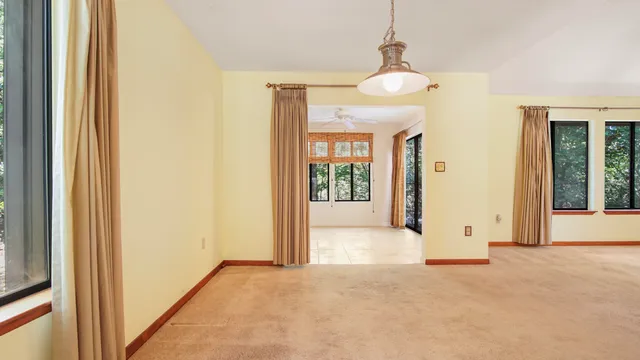 a view of a house with a backyard