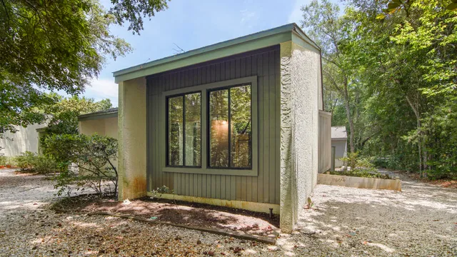 a view of a house with a yard and plants