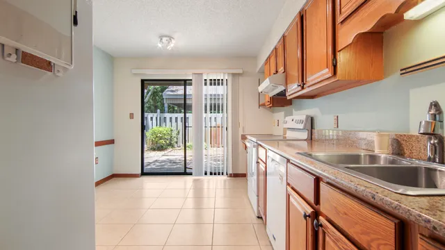 a view of a backyard of the house