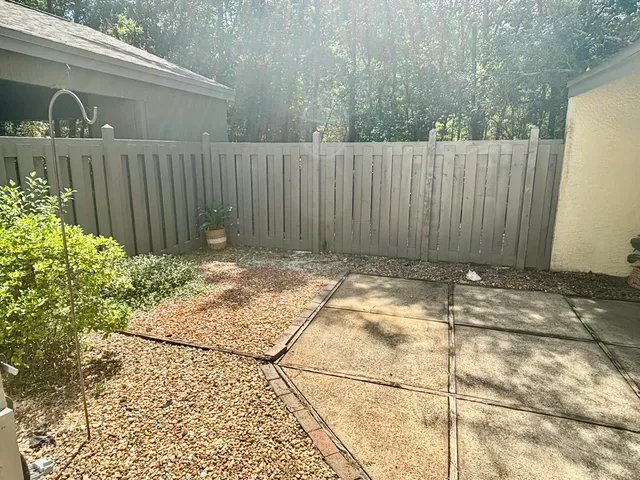 a kitchen with stainless steel appliances granite countertop a sink and a stove next to a window