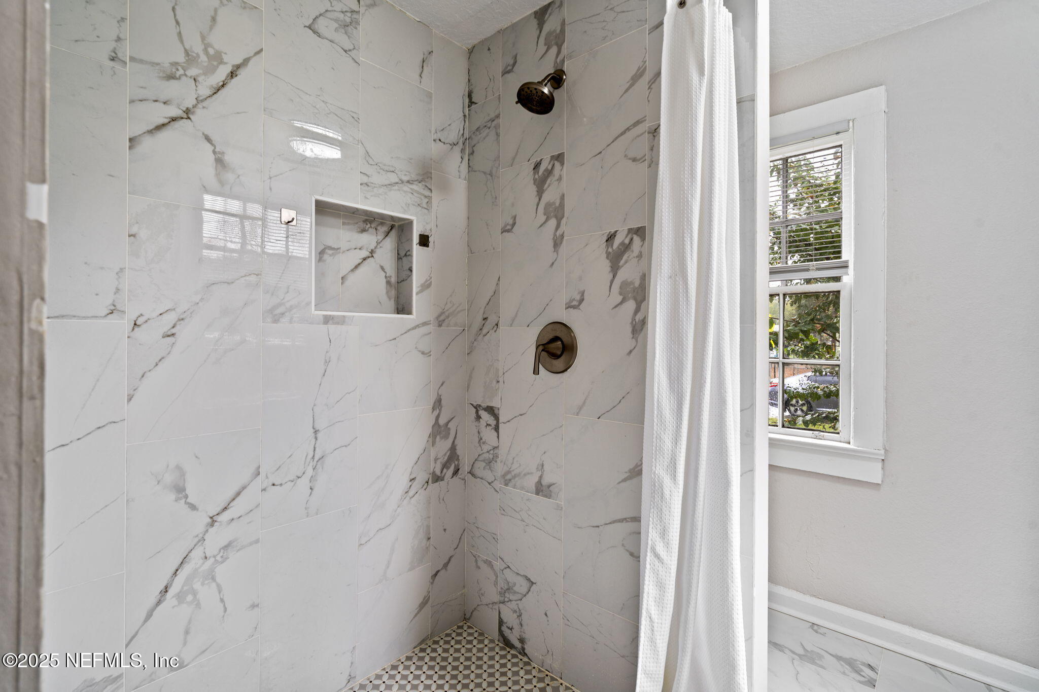 3910 Grant Road Jacksonville, FL 32207 - Photo 12 of 36 a bathroom with a shower