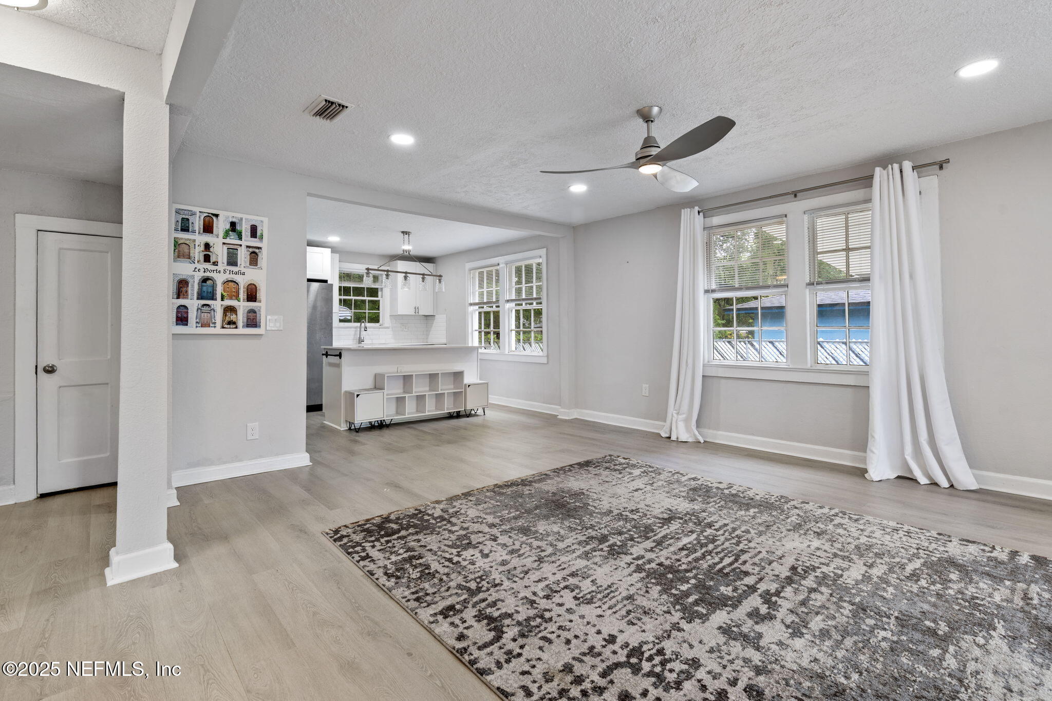3910 Grant Road Jacksonville, FL 32207 - Photo 16 of 36 a view of a big room with windows and cabinet