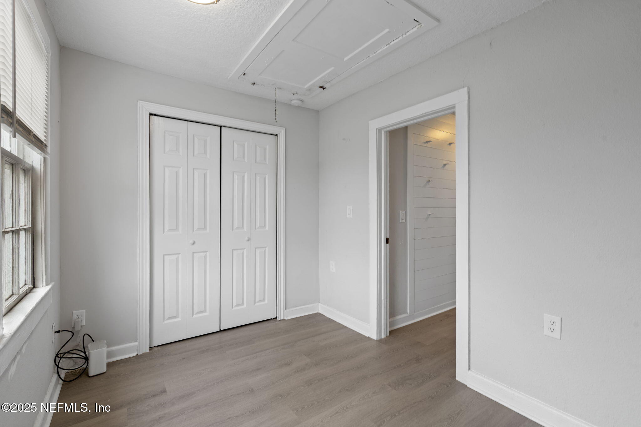 3910 Grant Road Jacksonville, FL 32207 - Photo 17 of 36 a view of an empty room with closet and a window