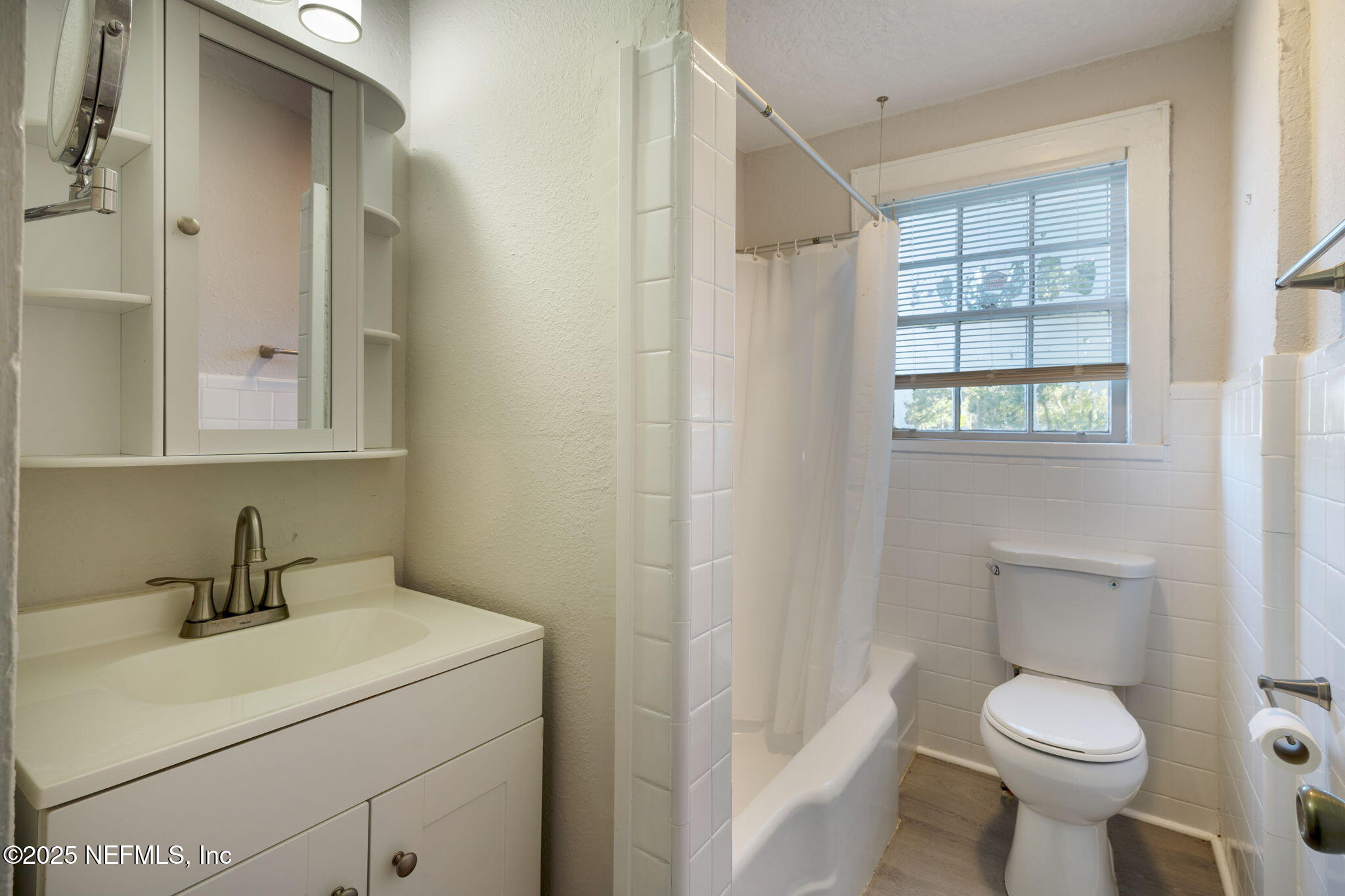 3910 Grant Road Jacksonville, FL 32207 - Photo 19 of 36 a bathroom with a toilet sink and mirror