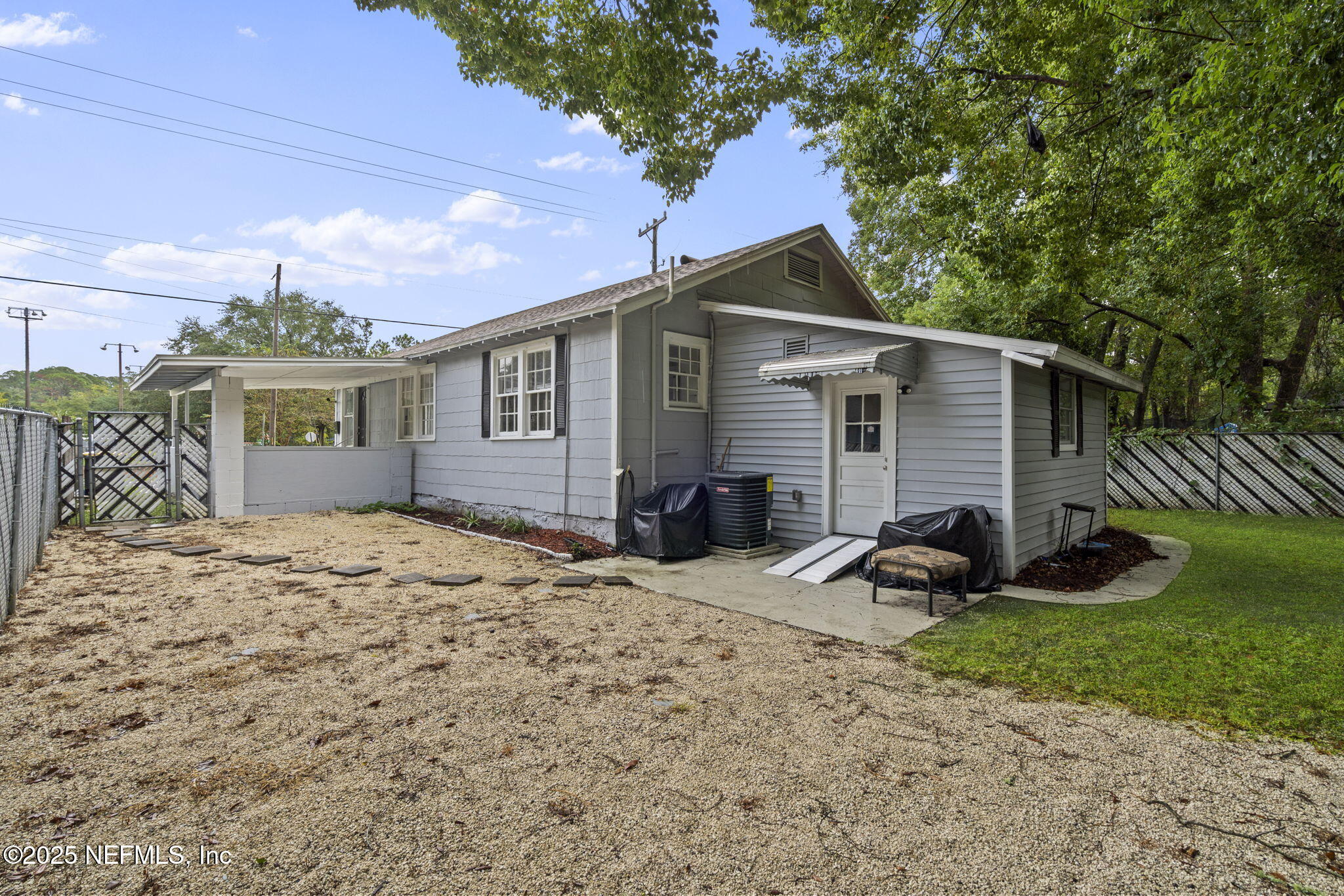 3910 Grant Road Jacksonville, FL 32207 - Photo 26 of 36 a view of a house with backyard and trees