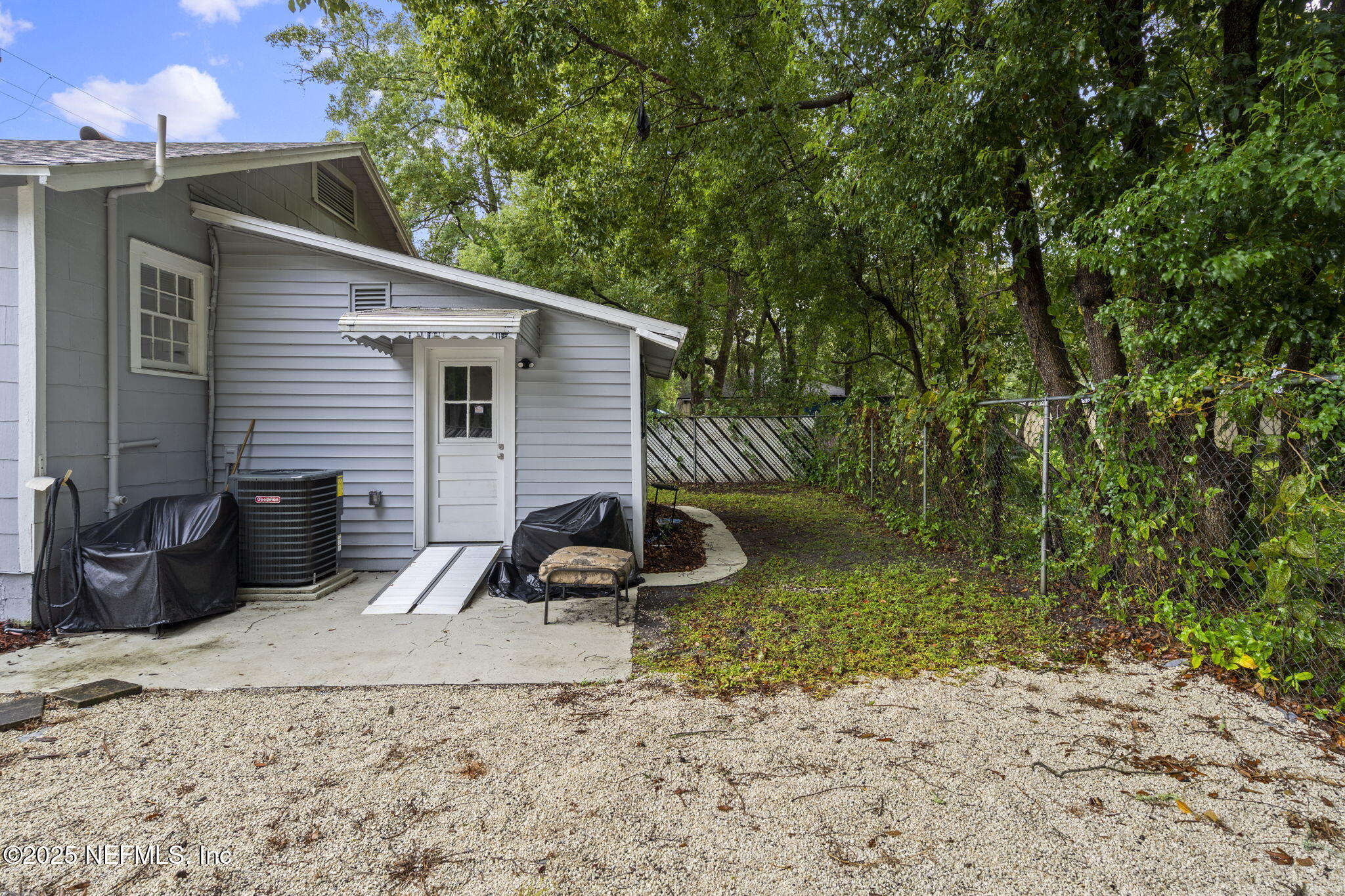 3910 Grant Road Jacksonville, FL 32207 - Photo 27 of 36 a backyard of a house with seating space
