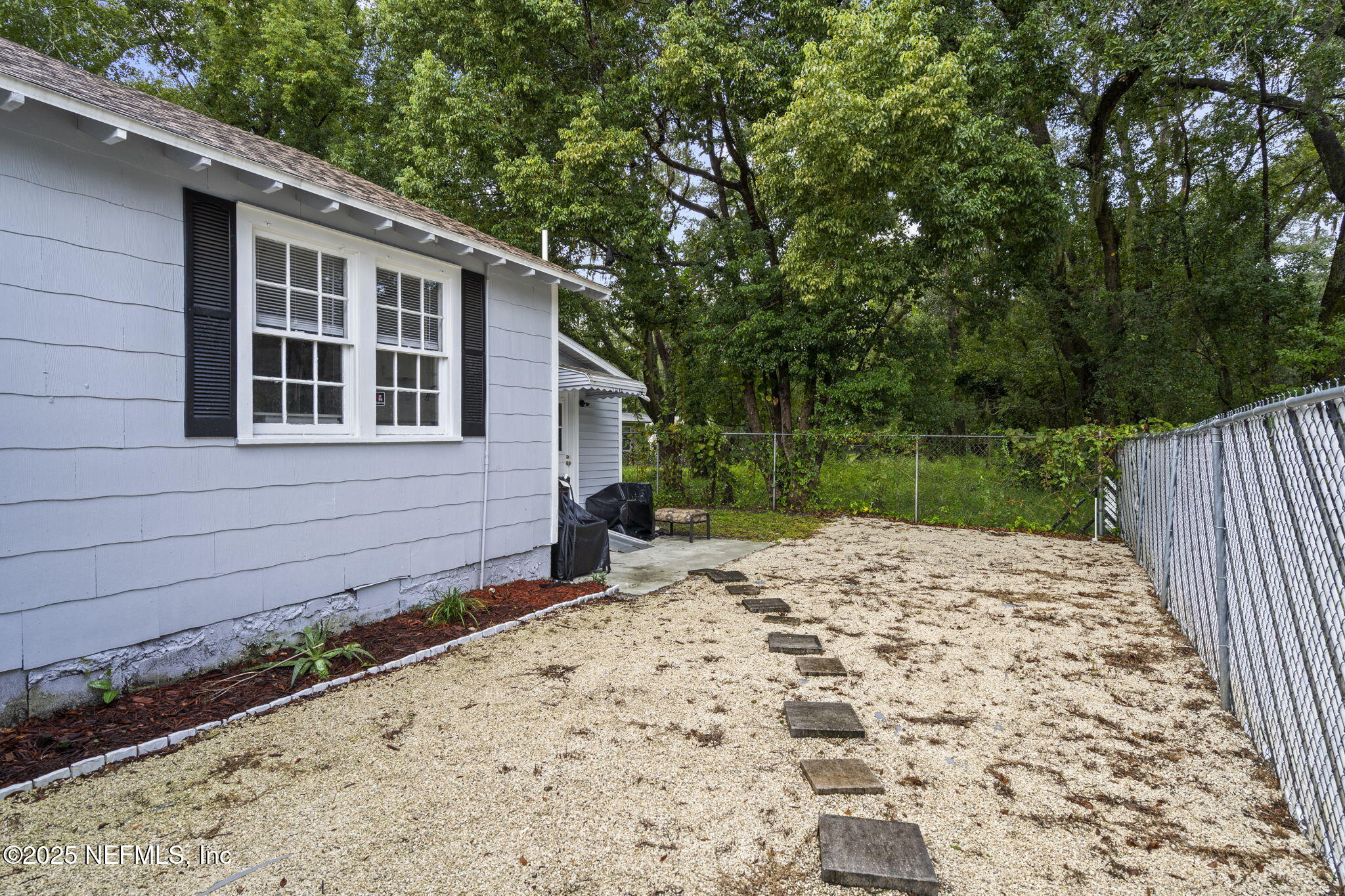 3910 Grant Road Jacksonville, FL 32207 - Photo 29 of 36 a backyard of a house with lots of green space