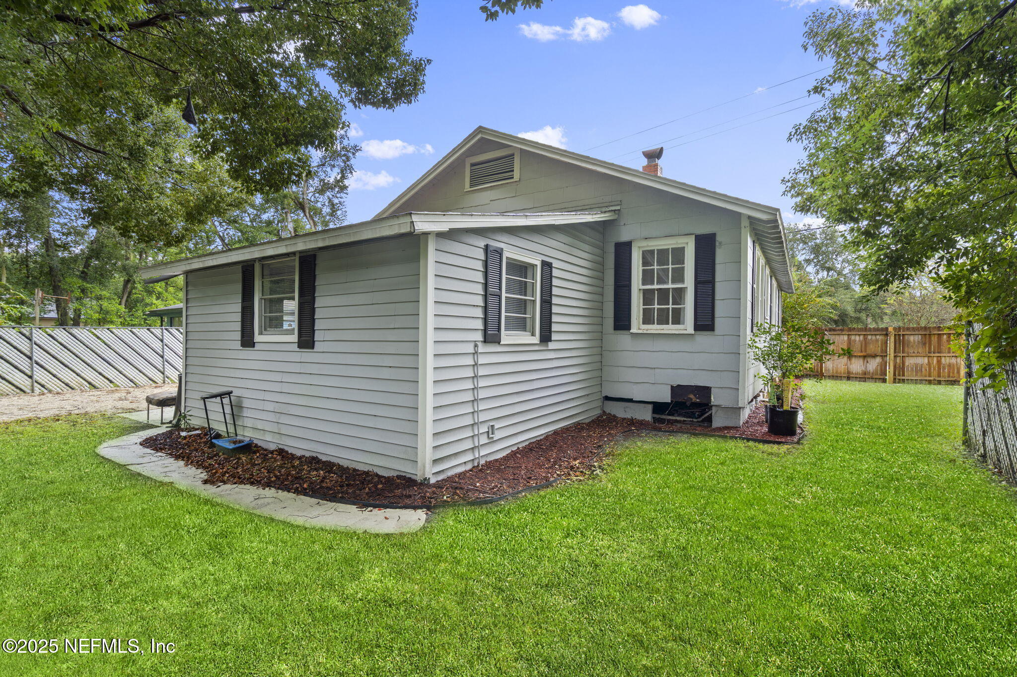 3910 Grant Road Jacksonville, FL 32207 - Photo 30 of 36 a front view of a house with a garden