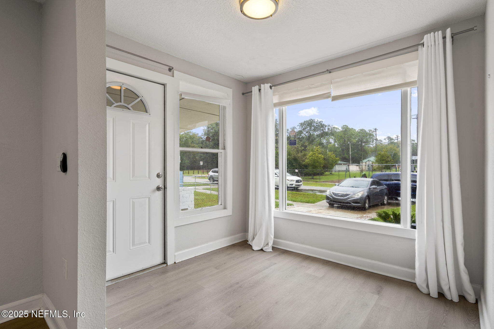 3910 Grant Road Jacksonville, FL 32207 - Photo 3 of 36 a view of a room with a large window and an outdoor view