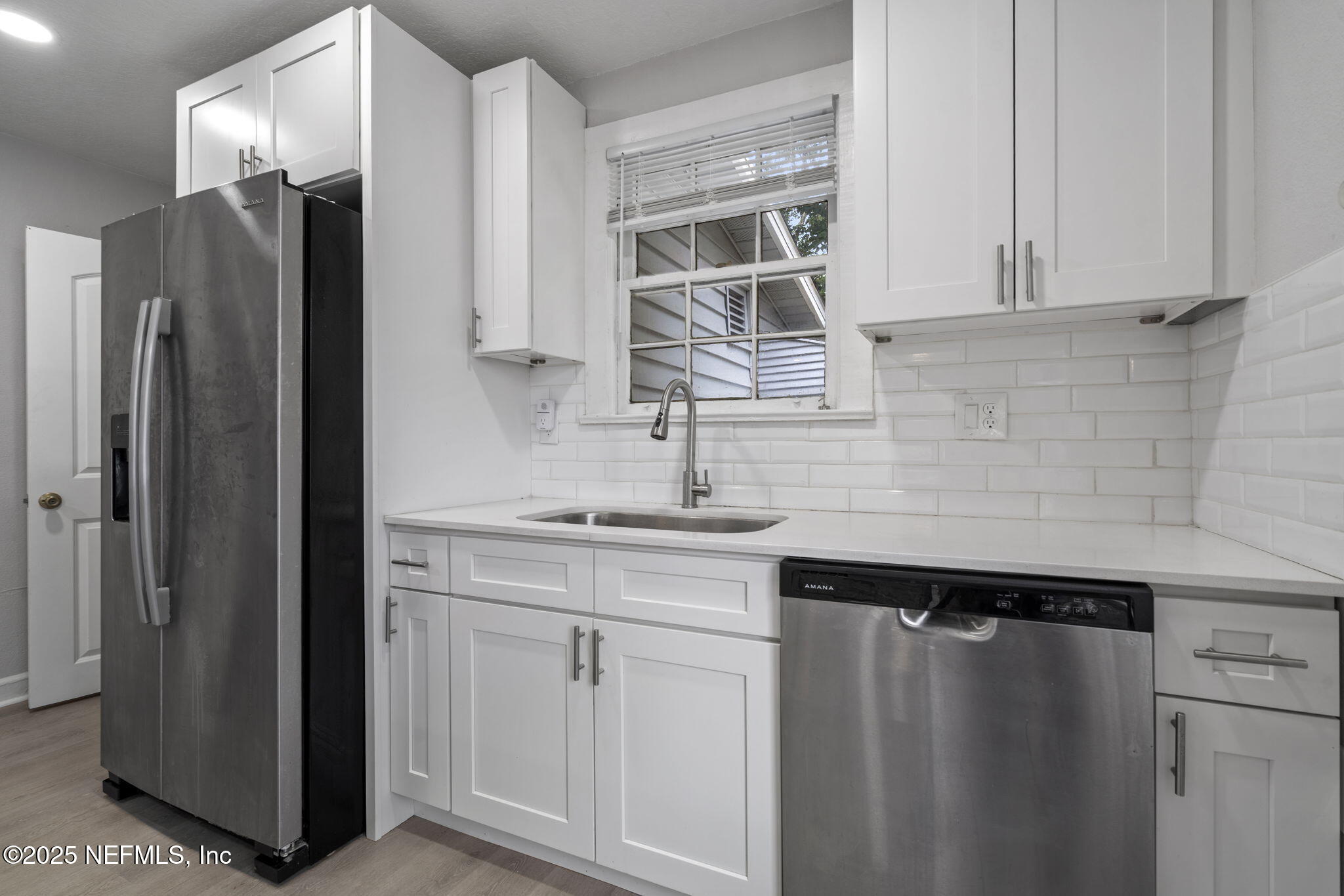 3910 Grant Road Jacksonville, FL 32207 - Photo 9 of 36 a kitchen with a sink and cabinets